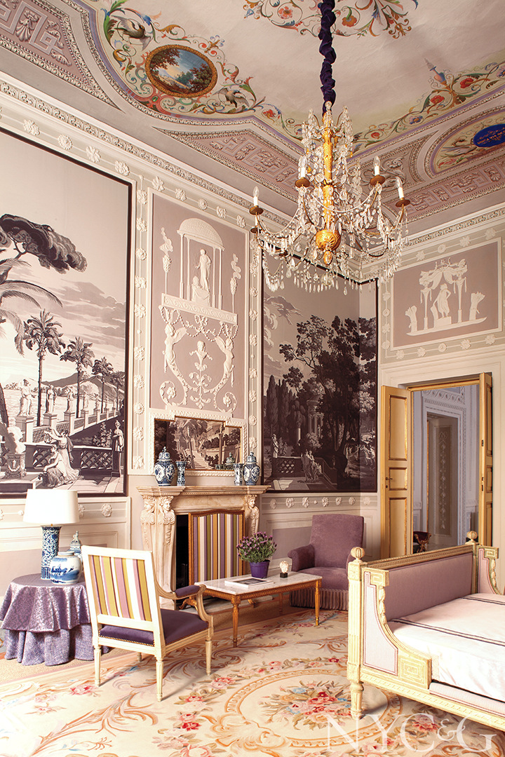 Guest bedroom in Lucca, Italy with fireplace and sitting area.