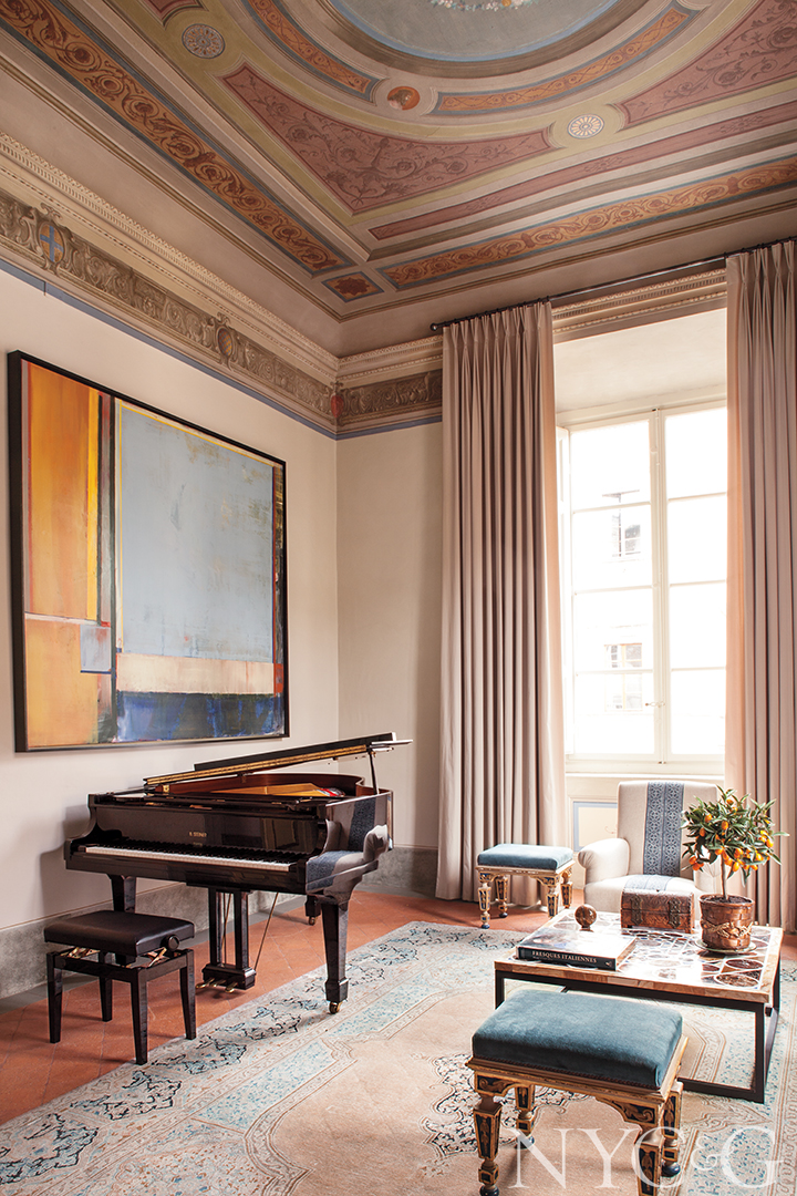 Piano and modern art in music room in Lucca, Italy apartment.