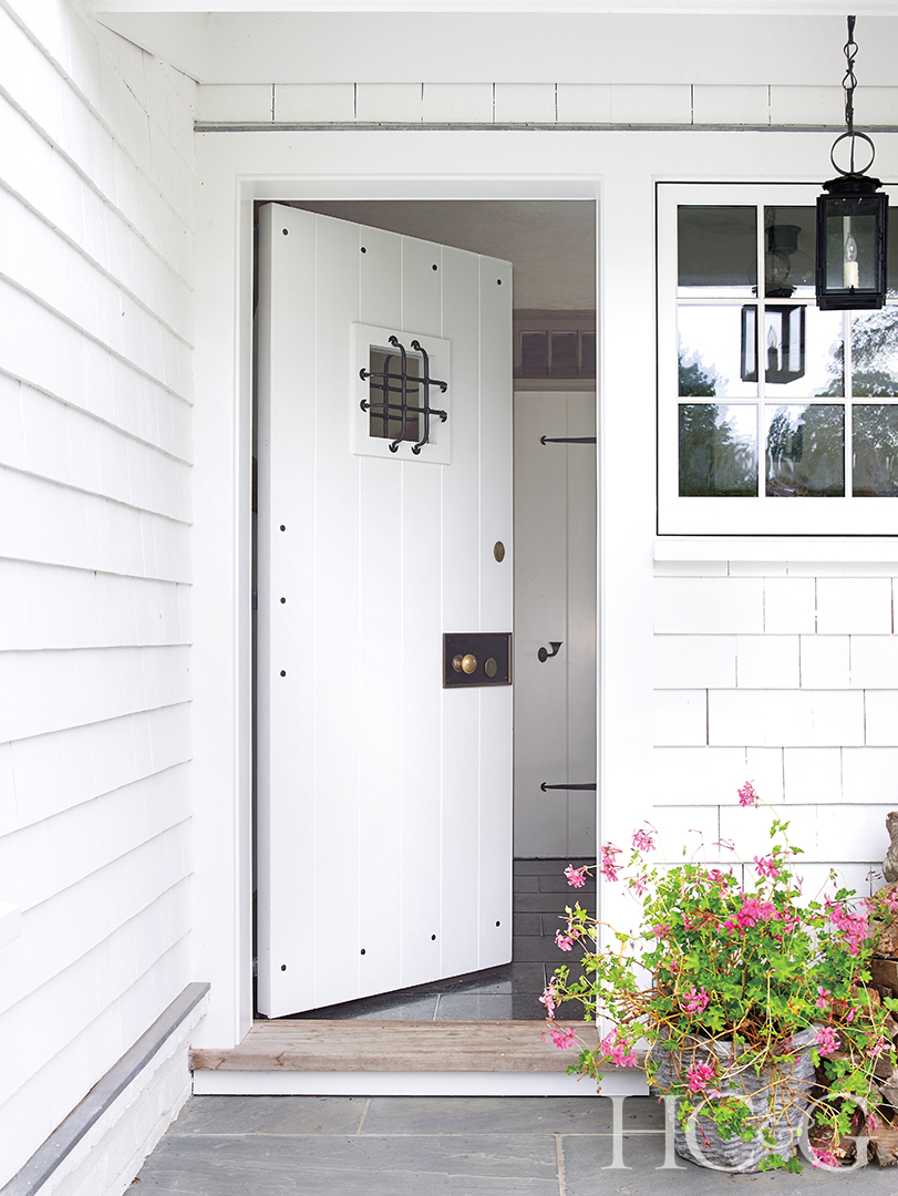 An open white door leading into the home.