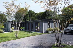 metal siding on exterior; minimalist landscaping