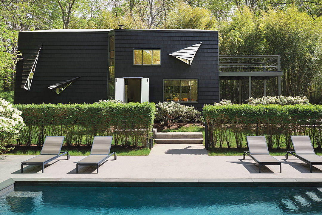 Tour an Early 1960s Home with a Black Exterior and White Interiors
