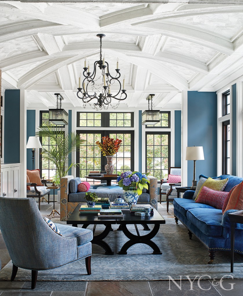 Huge Blue Great Room With Multi Colored Pillows And Accents 839x1024