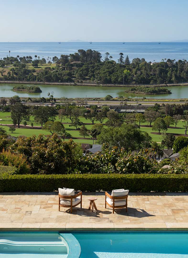 Romantic ocean front view with comfortable poolside seating