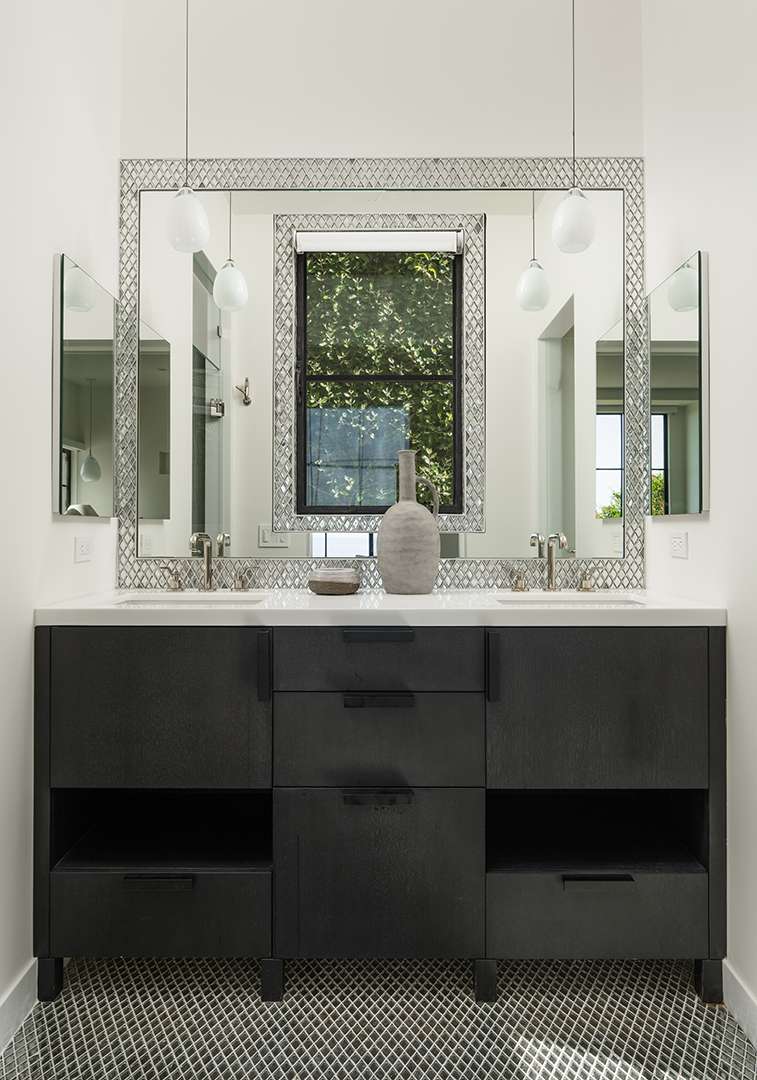 Montecito bathroom with large, chic mirror