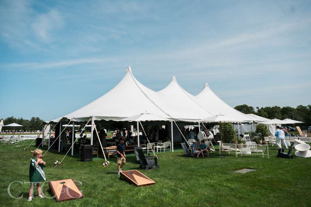 Kids playing cornhole at CTC&G Players' Lounge at Greenwich Polo Club
