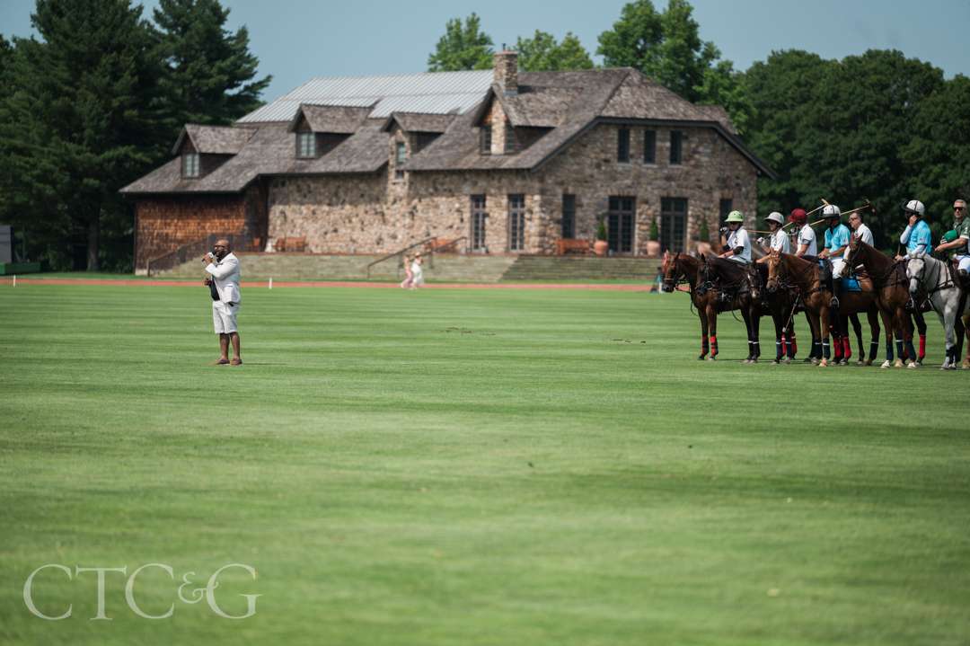 Polo players, horses, and singer at Greenwich Polo Club
