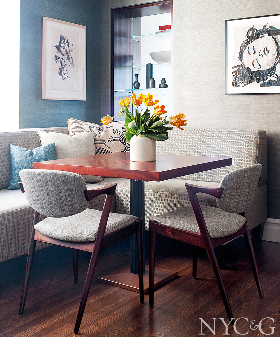 Detailed drawings line the cozy dining room