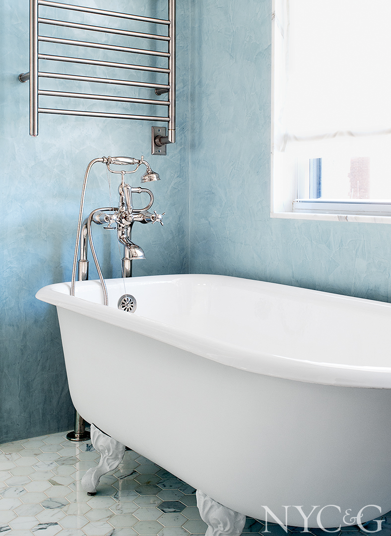 Elegant master bathroom with a Saxby tub and filler