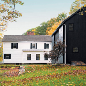 An 1830's Farmhouse Gains a Modern Sensibility Through an Unlikely Blend of Beloved Antiques, Contemporary Furnishings, French Textiles and Bold Color