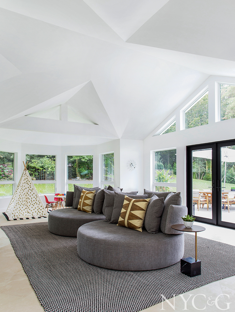 Spacious family room with circular shaped sofas