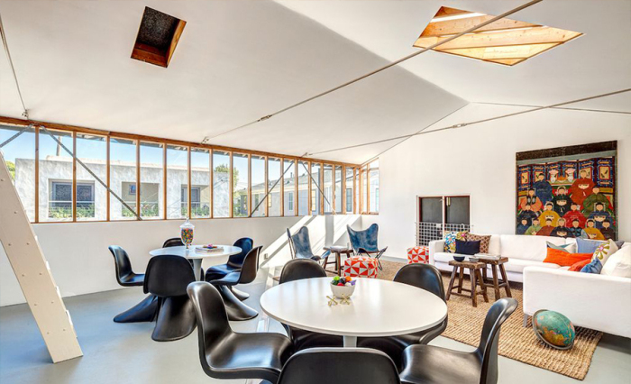 The two-story studio space is currently being used as a game room.