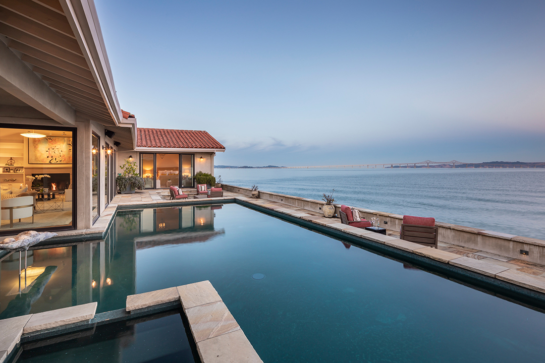 Sleek pool with water views