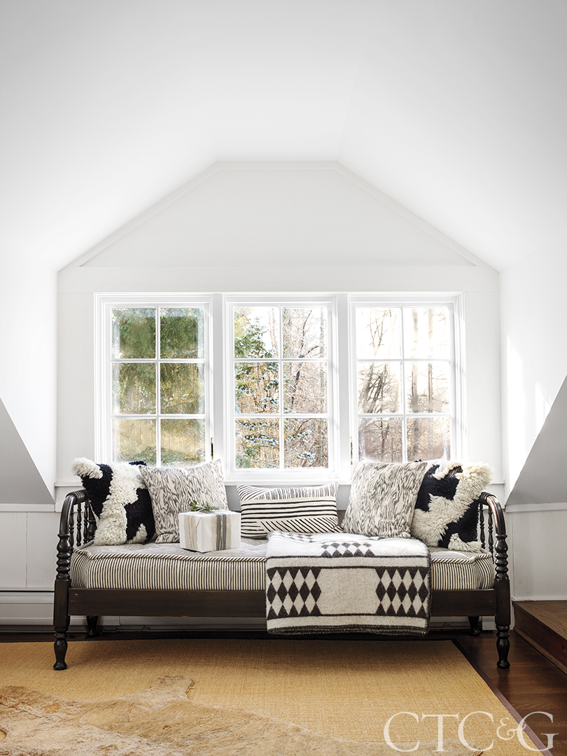 Daybed with black and white pillows in neutral modern farmhouse