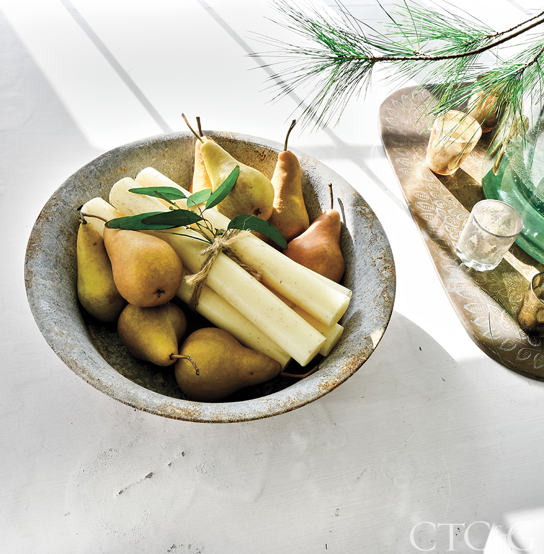 A vintage bowl filled with pears