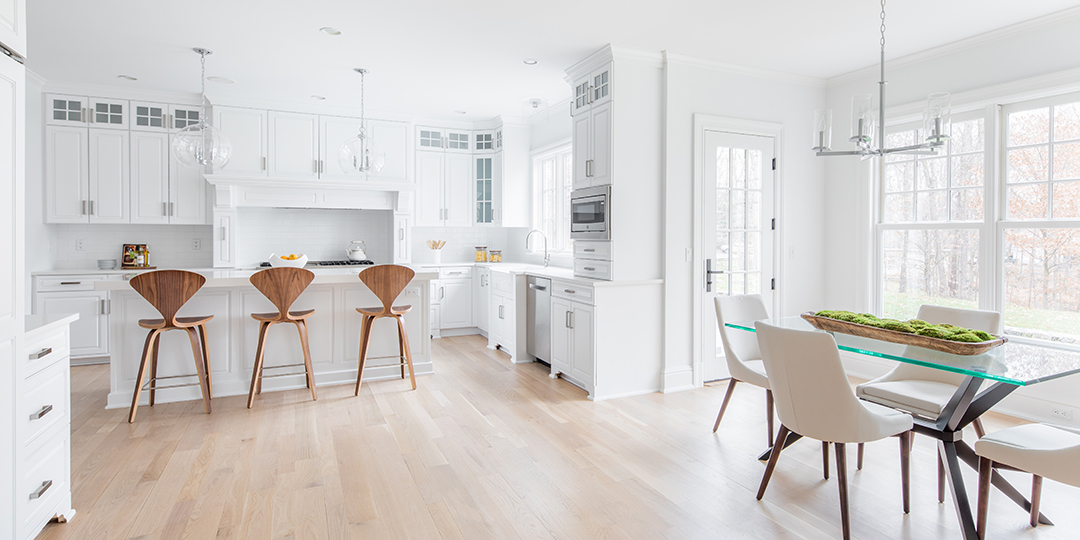 Bright white kitchen and breakfast nook