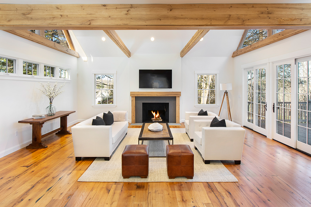 Living room with wood beamed ceilings at Bruce Willis's Bedford, NY home