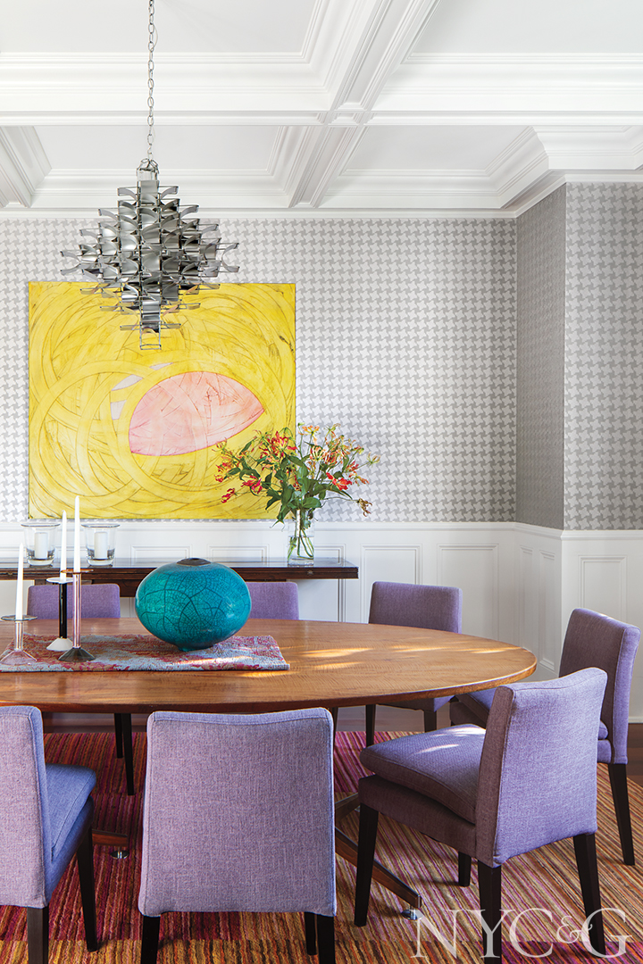 Dining room with accent purple chairs and wallpaper