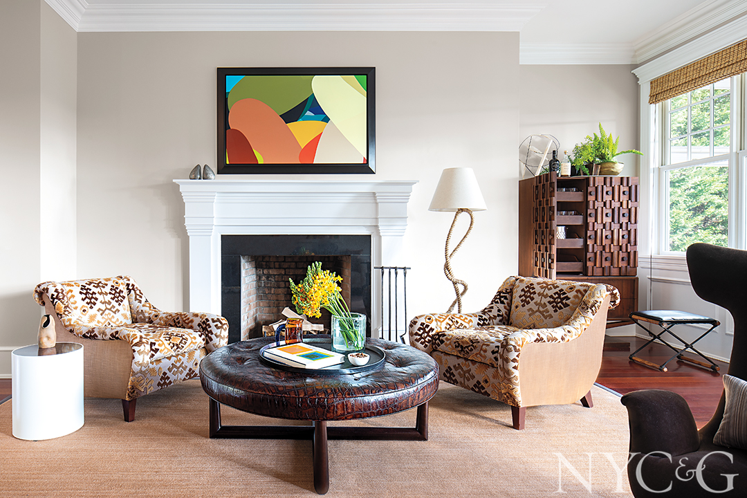 Sitting room with earthy warm tones and a fireplace