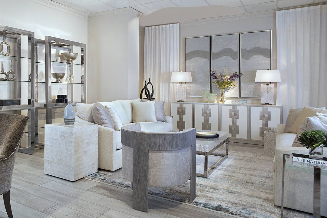 living room with mirrors, rug, chairs and soft lighting