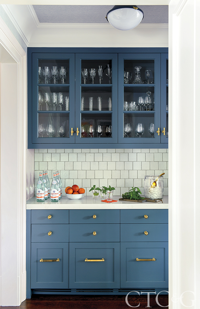 Blue bar to the side of the kitchen.