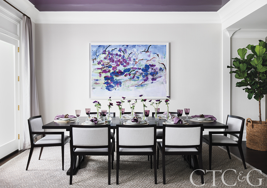 Bright dining room with natural light and purple tones.