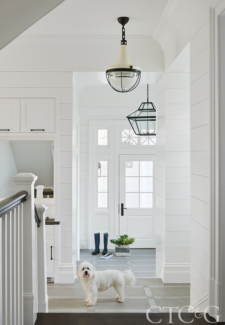 Hallway with natural light leading outside.