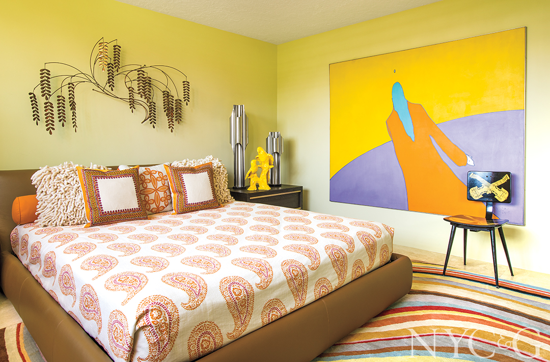 guest bedroom with pink bedspread.
