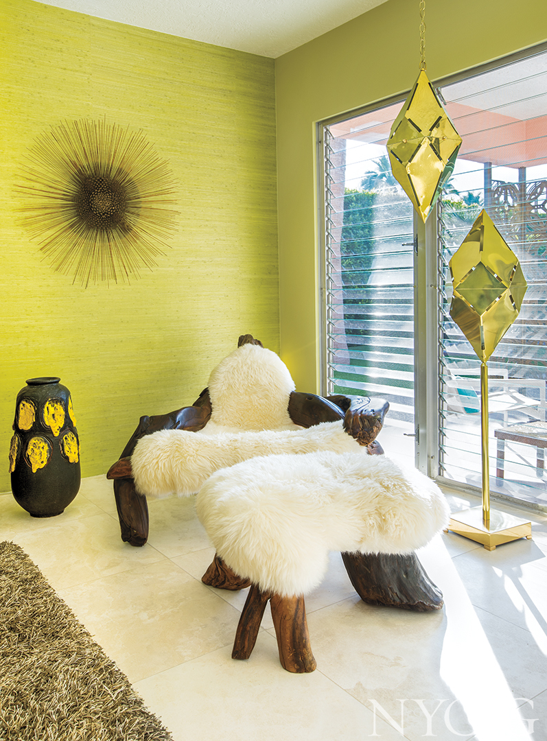 chair made with sheep skin in front floor to ceiling windows.