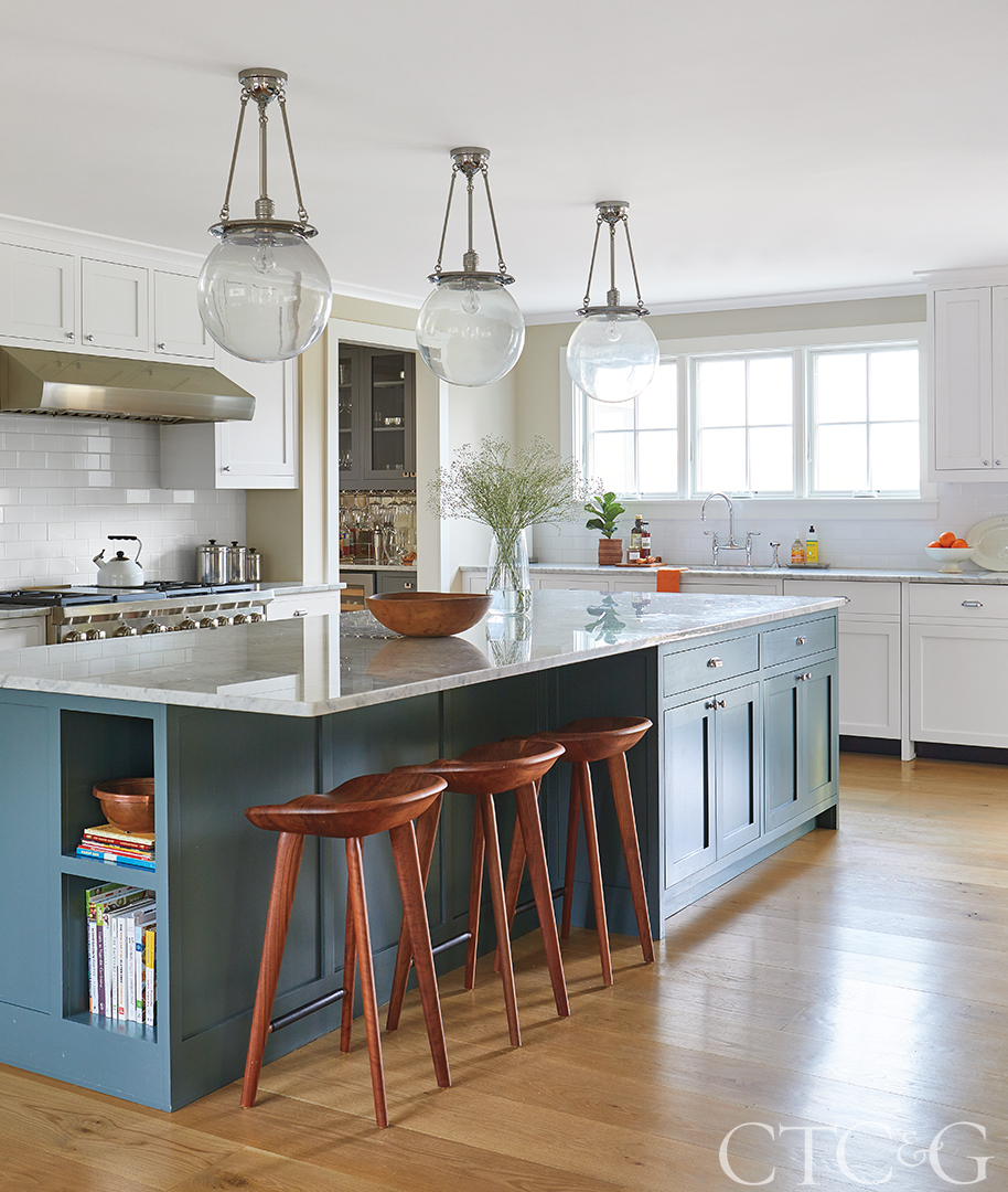 white modern kitchen with blue island