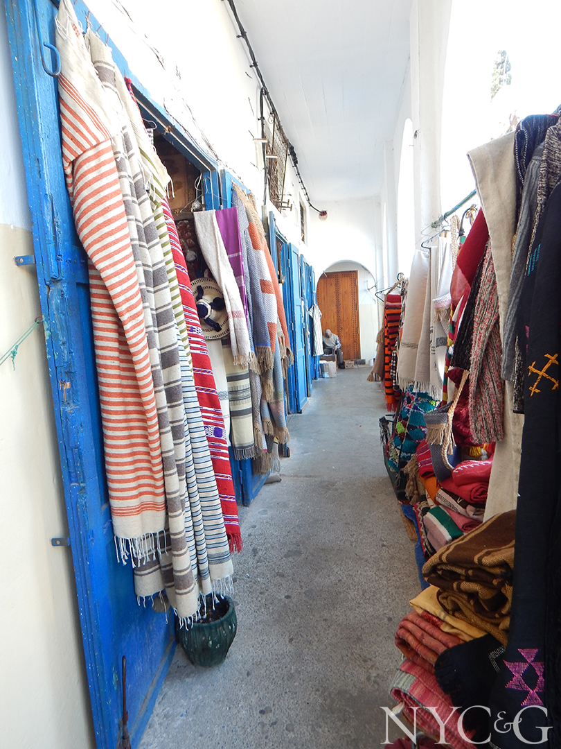 fabrics located throughout a arched hallway.