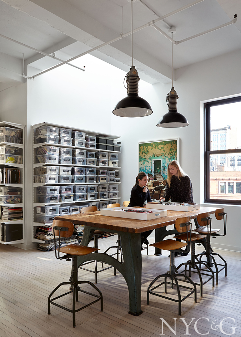 Cabinetry with see-through bins that hold textiles and material samples
