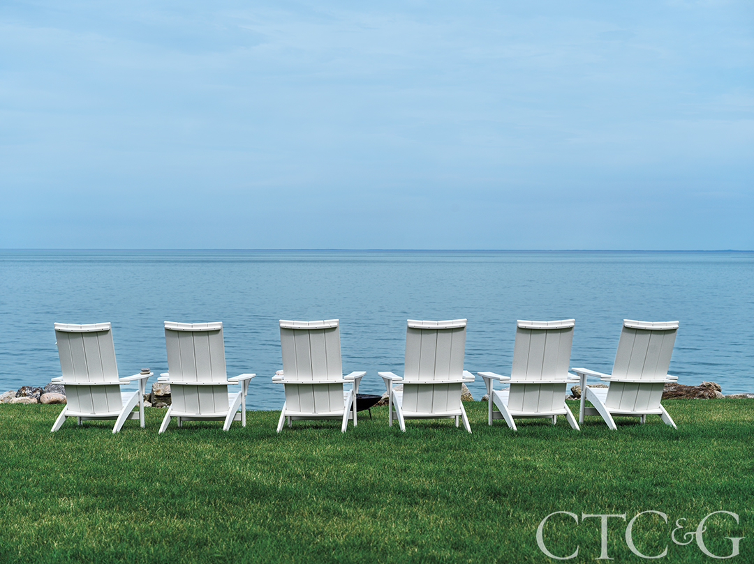Chairs overlooking view of ocean
