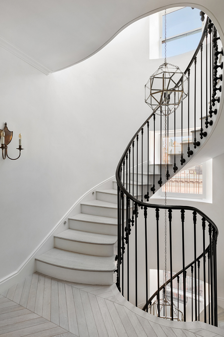 white staircase and black railing