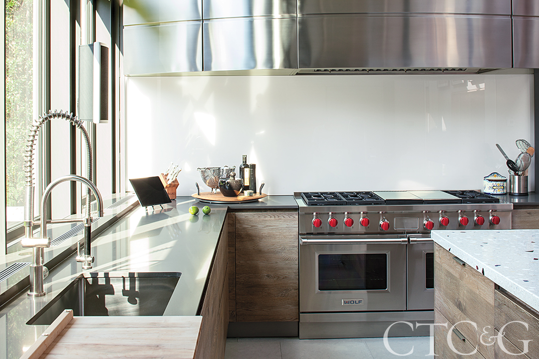 Kitchen with custom designed hood
