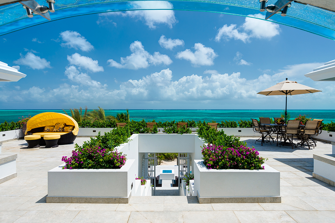 Oceanfront Turks and Caicos Villa Garden and Lounging Area