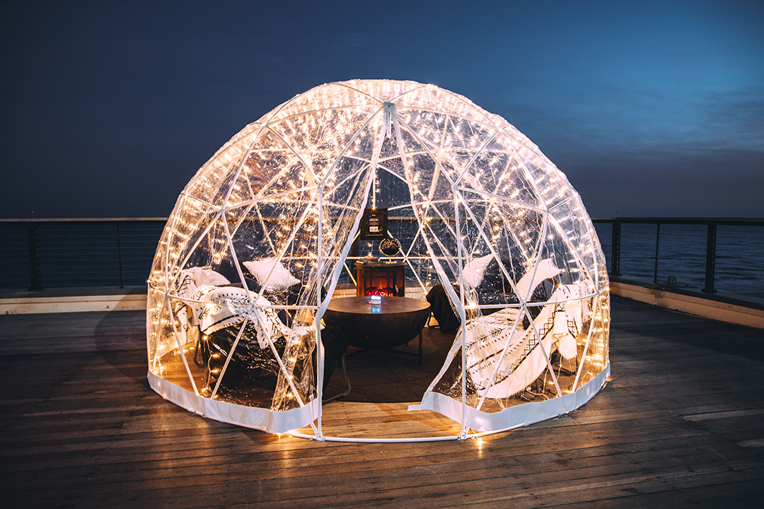 Igloo lit up at night.