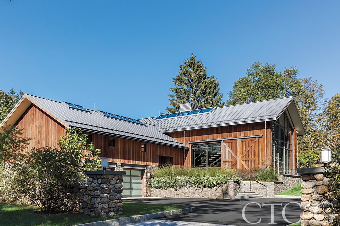 view of guest house, dirvewya and garage