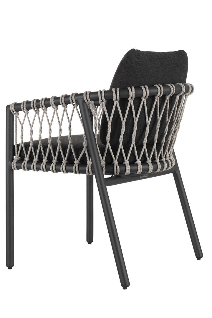 A black chair with a black cushion and a white rope backing.