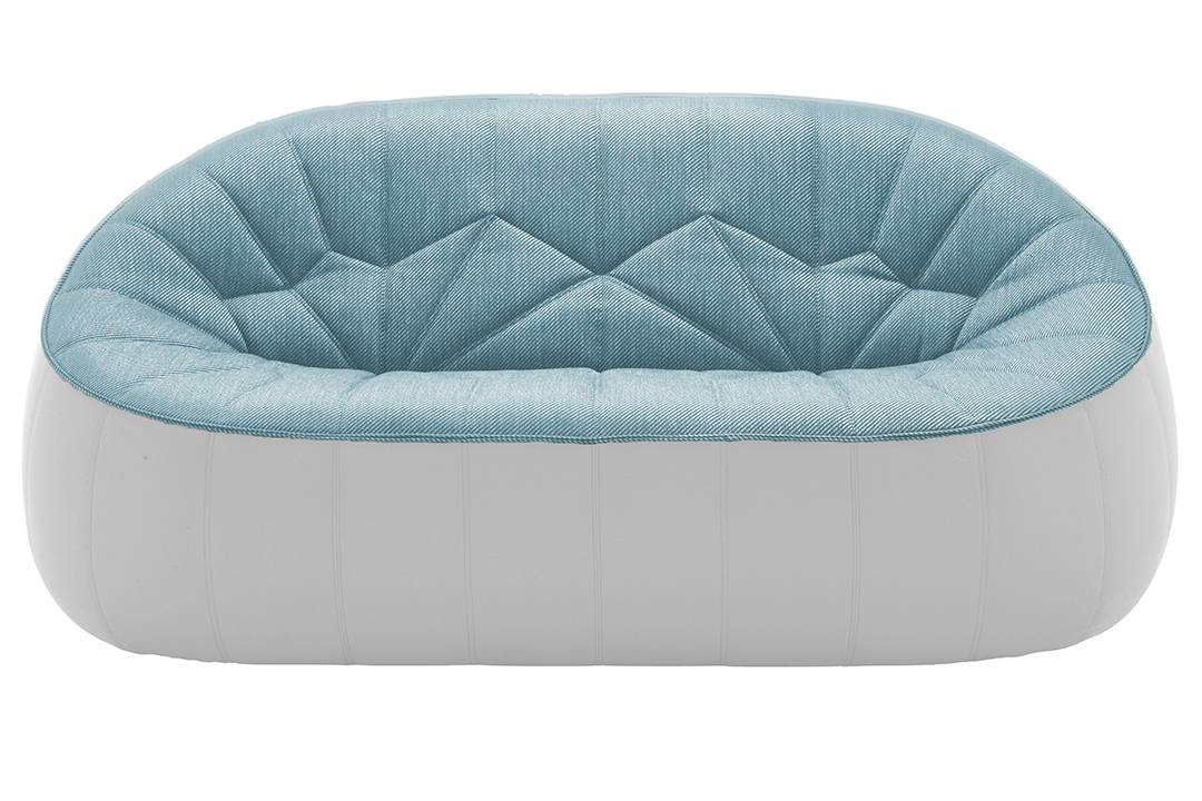 Rounded ottoman with white exterior and light blue interior.
