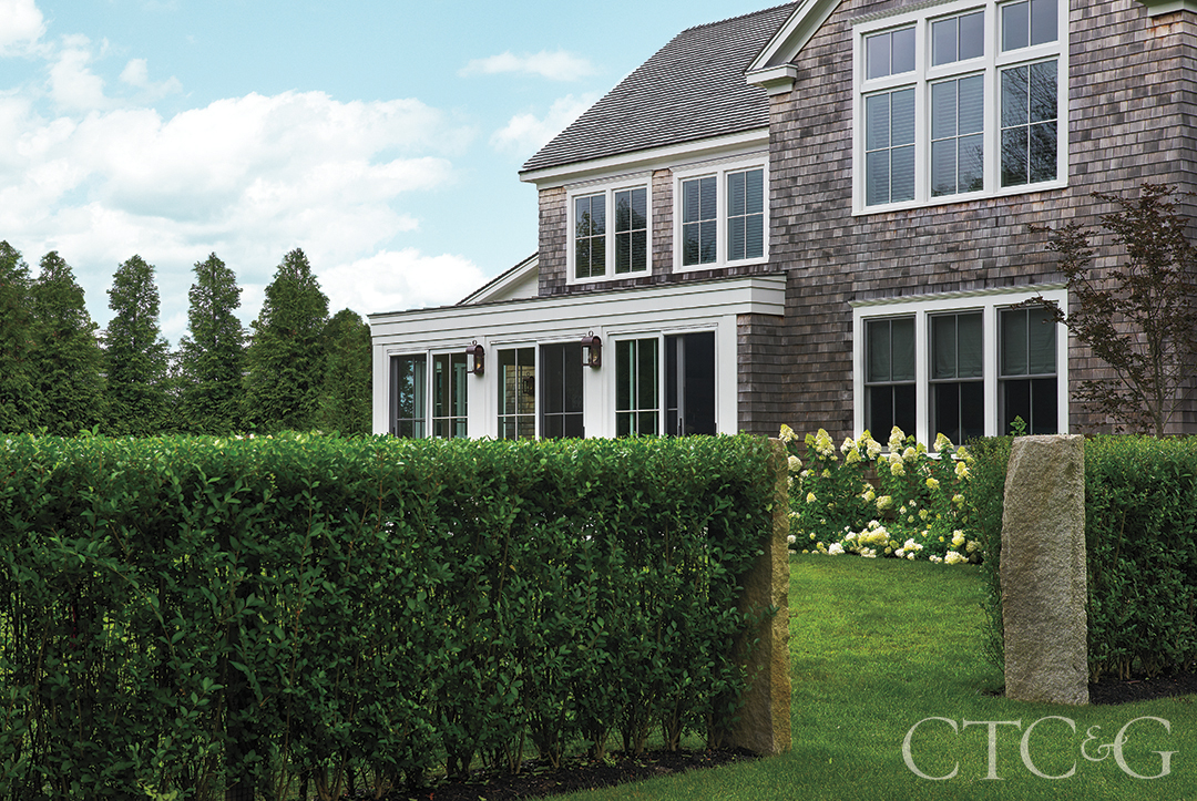 Martha's Vineyard New Construction's Garden With Hedges And Granite Pillars