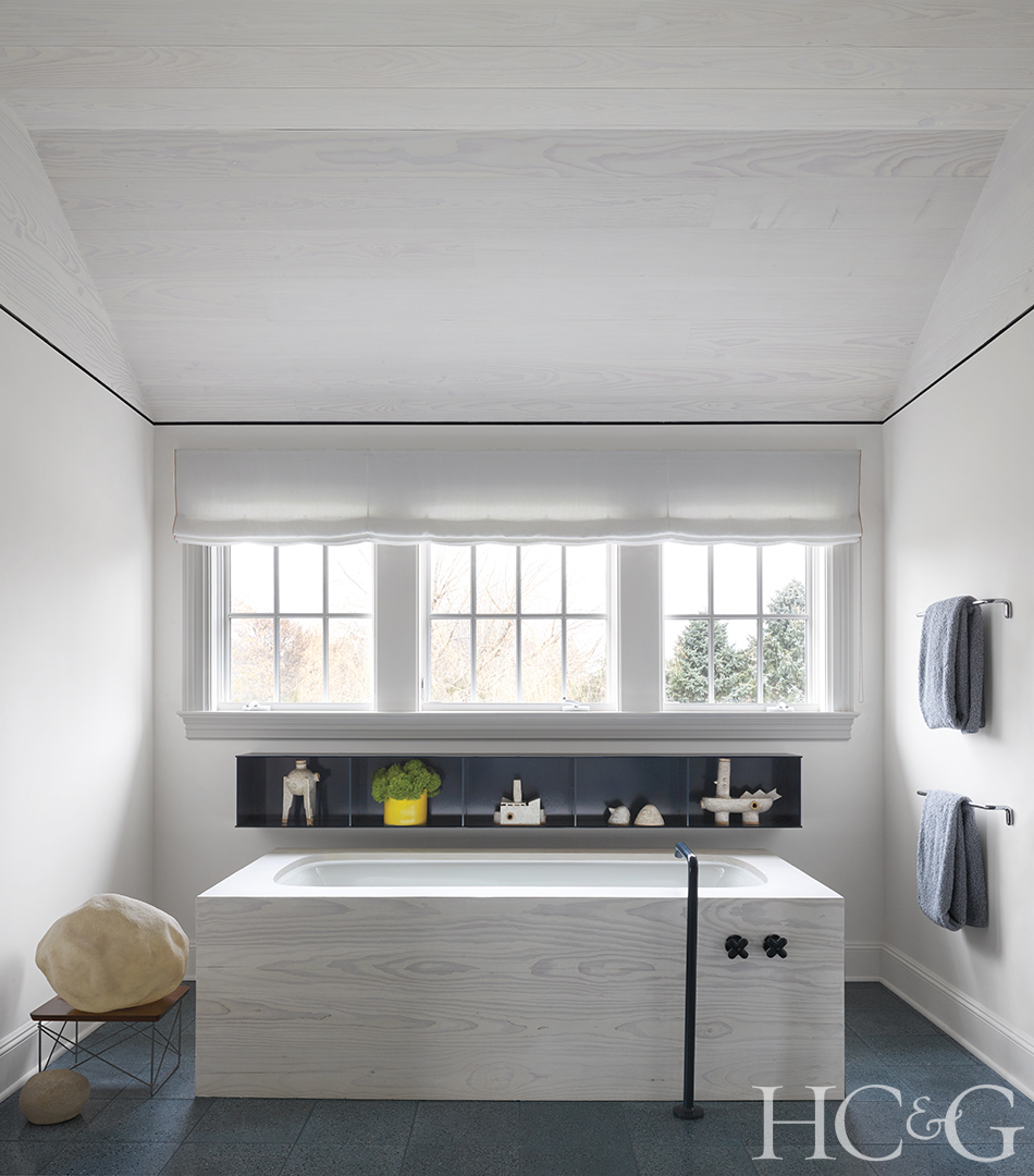 A predominately white master bathroom with square tub.