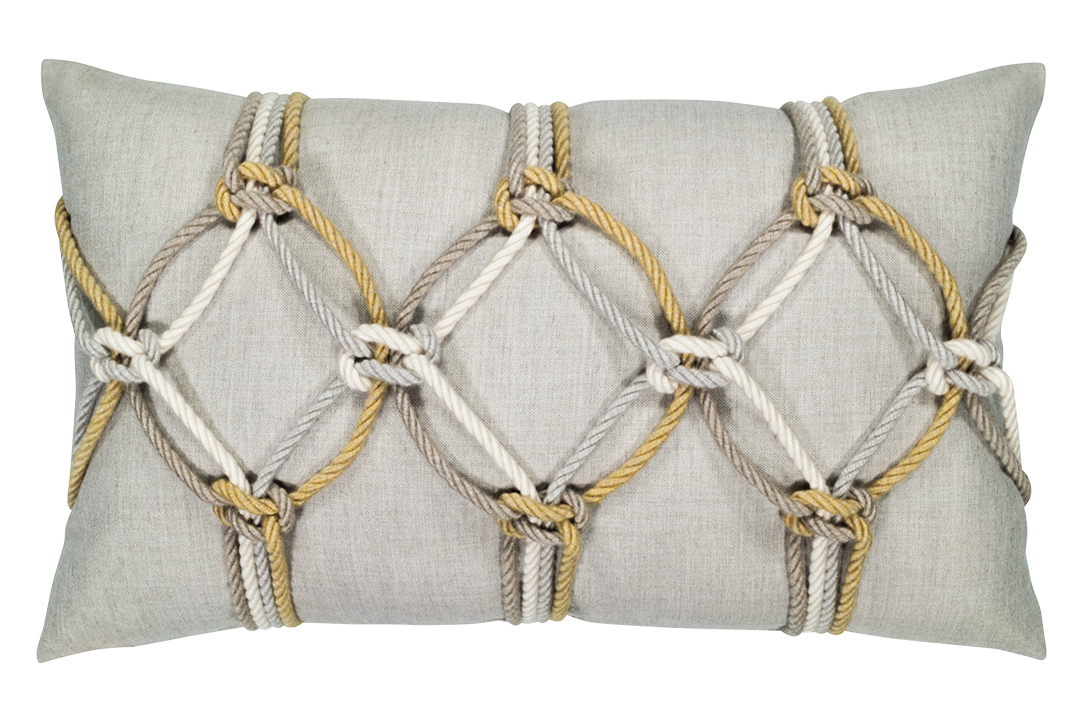 A grey pillow with white, silver, gold, and brown rope tied in nautical knots.