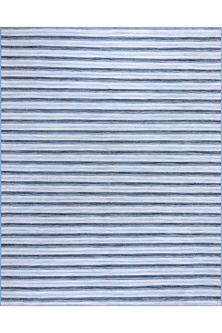 A denim blue and lighter blue striped rug.