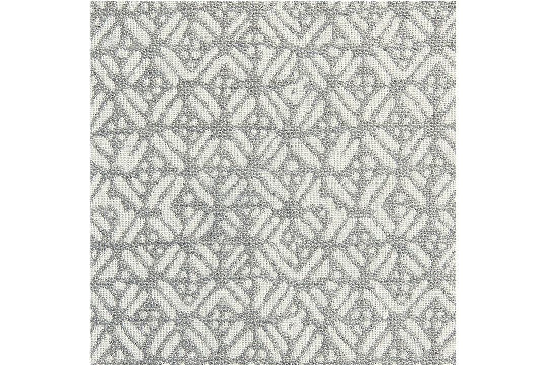 A woven mat with white and grey patterning.