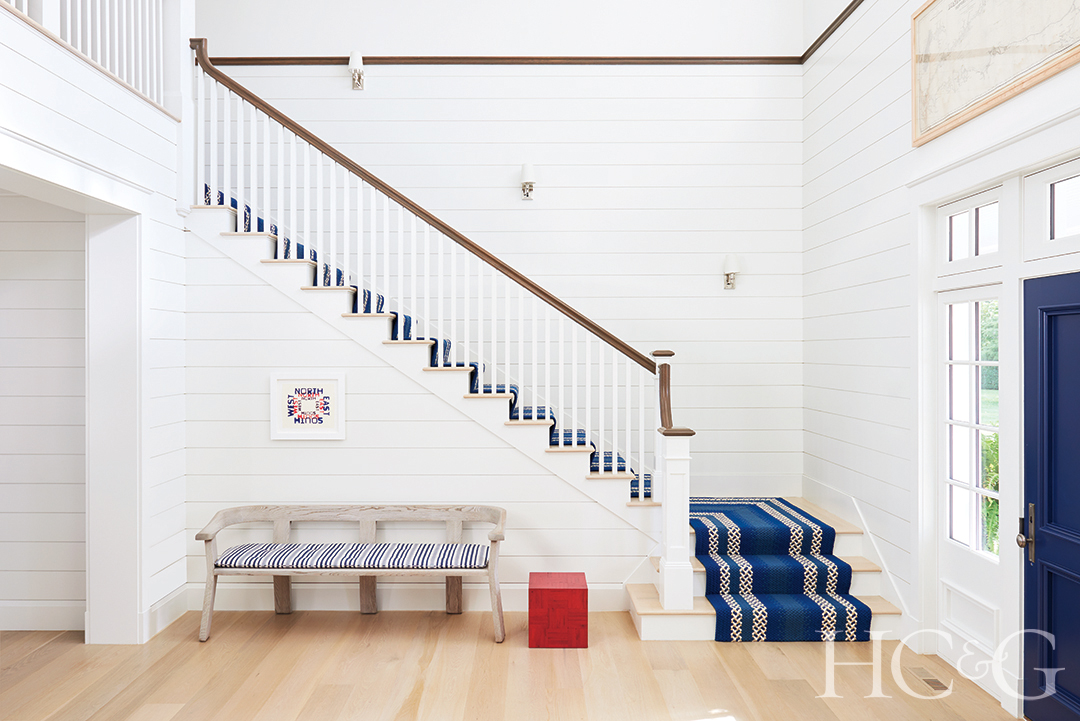 Westhampton Beach Foyer With Striped Carpet On Staircase