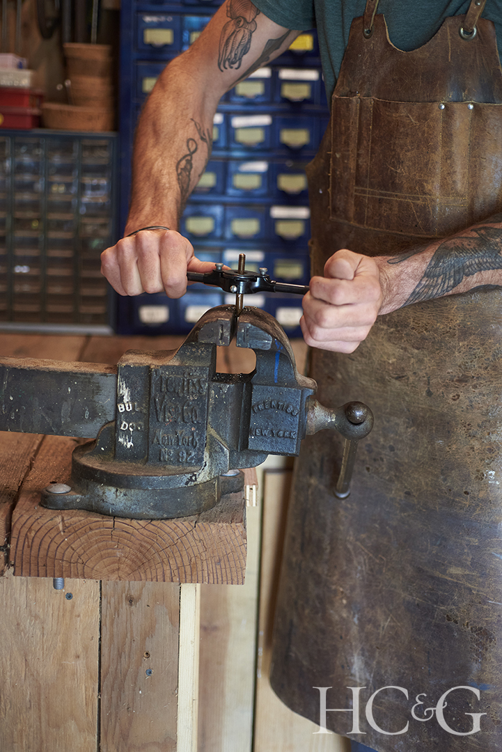Michael Javidi Preparing A Bronze Rod