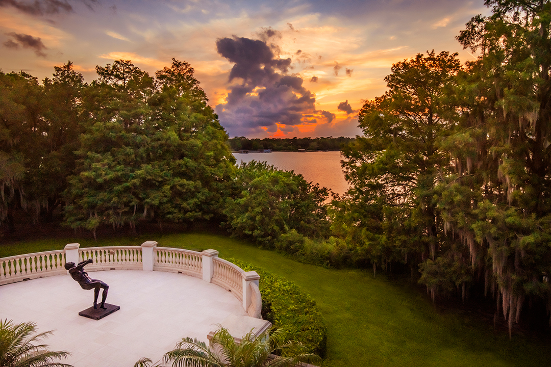 British Billionaire Lists Lakefront Florida Mansion With Hidden Treasures Terrace Sunset