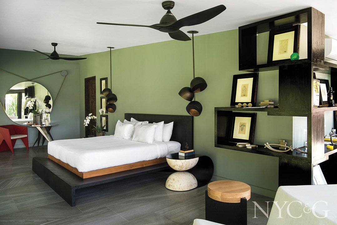 green walls with black details in master bedroom