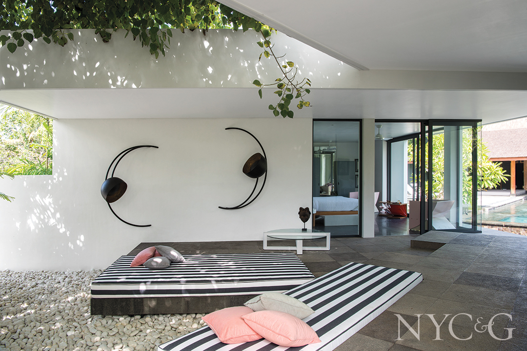 bali courtyard with striped daybeds