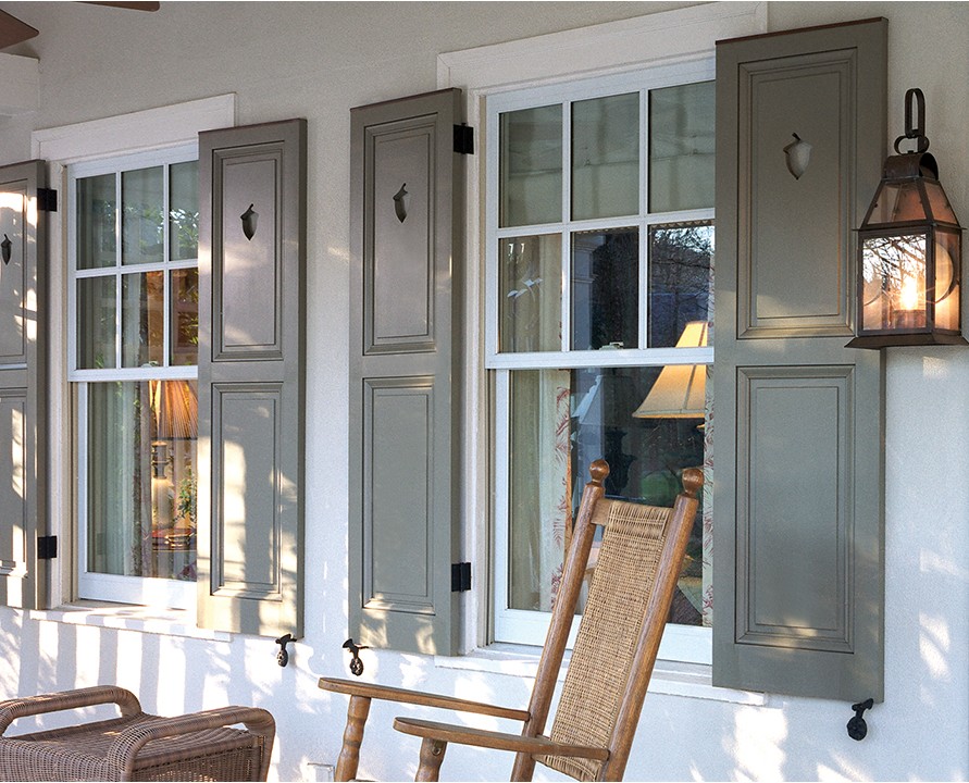 Gray Panel Shutters On Porch